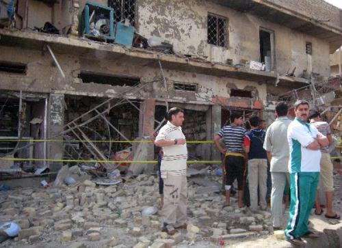 Iraqis&nbsp;stand&nbsp;in&nbsp;front&nbsp;of&nbsp;the&nbsp;collapsed&nbsp;building&nbsp;after&nbsp;a&nbsp;seris&nbsp;of&nbsp;deadly&nbsp;bombings&nbsp;on&nbsp;Friday&nbsp;in&nbsp;Baghdad.&nbsp;Reportedly&nbsp;at&nbsp;least&nbsp;60&nbsp;people&nbsp;were&nbsp;killed&nbsp;and&nbsp;117&nbsp;wounded&nbsp;in&nbsp;the&nbsp;bombings&nbsp;in&nbsp;Baghdad&nbsp;and&nbsp;western&nbsp;Anbar&nbsp;province.(Xinhua/AFP&nbsp;Photo)&nbsp;