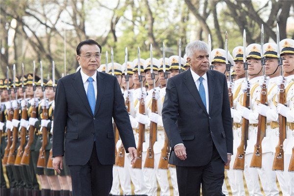 Chinese Premier Li Keqiang has welcome the visiting Sri Lankan Prime Minister at the Great Hall of the People in Beijing.