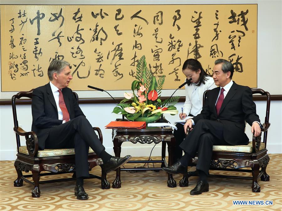 BEIJING, April 9, 2016 (Xinhua) -- Chinese Foreign Minister Wang Yi (1st R) meets with visiting British Foreign Secretary Philip Hammond in Beijing, capital of China, April 9, 2016. (Xinhua/Pang Xinglei)