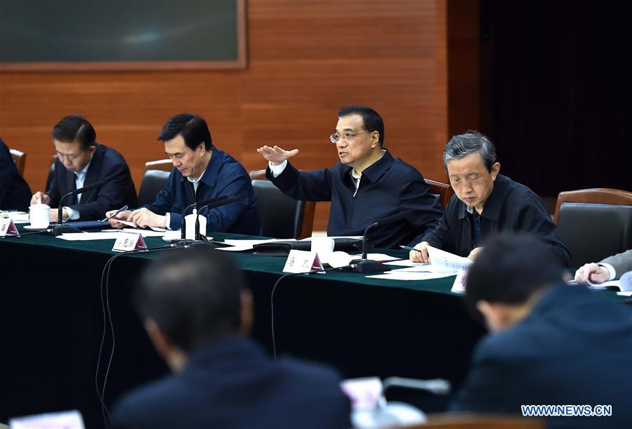 Chinese Premier Li Keqiang (2nd R rear) presides over a symposium on employment during his visit to the Ministry of Human Resources and Social Security in Beijing, capital of China, May 6, 2016. Li Keqiang inspected the Ministry of Human Resources and Social Security on May 6, urging for more efforts to support employment to guard against large-scale unemployment. (Xinhua/Li Tao)