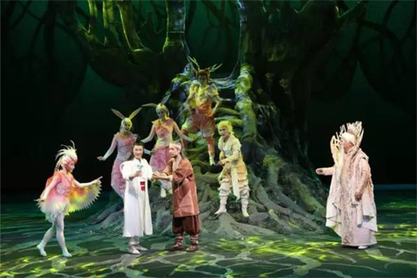 The theater stages its first production, the tale of the magical "Malan Flower".