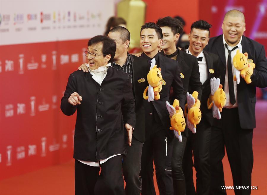 Chinese actor Jackie Chan (1st L) poses on the red carpet as he arrives for the opening ceremony of 2016 Shanghai International Film Festival in Shanghai, east China, June 11, 2016. (Xinhua/Ding Ting) 