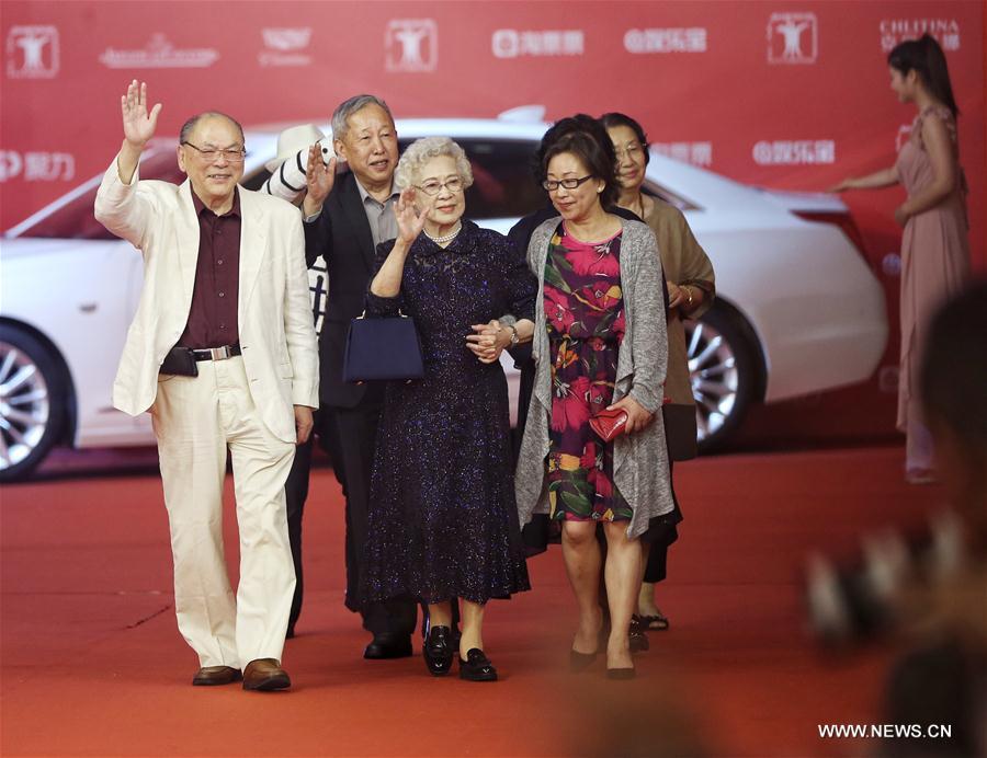 Chinese film artist Qin Yi (3rd L) poses on the red carpet as she arrives for the opening ceremony of 2016 Shanghai International Film Festival in Shanghai, east China, June 11, 2016. (Xinhua/Ding Ting) 