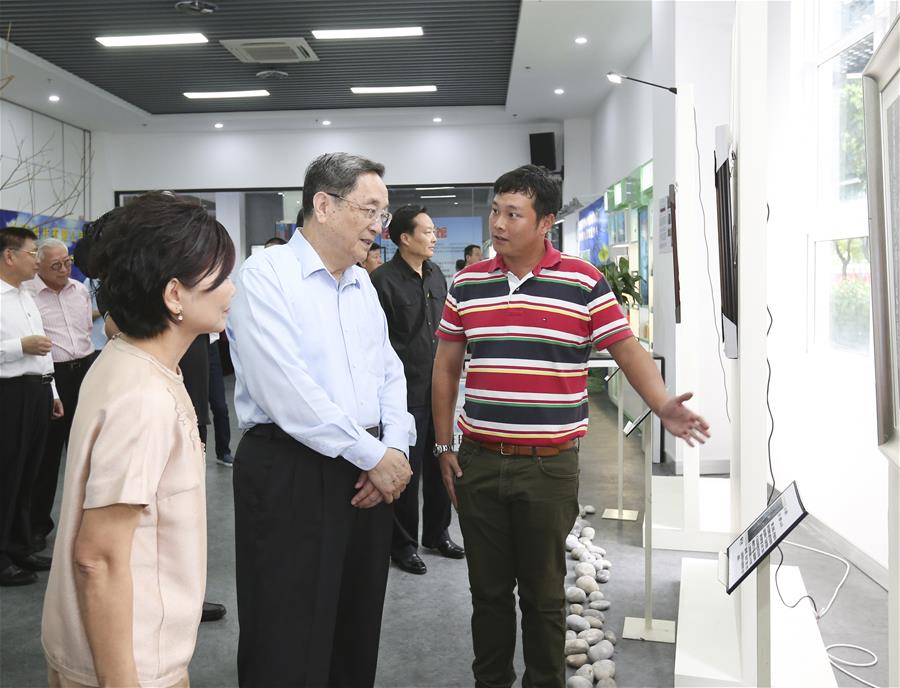 Yu Zhengsheng (2nd L), chairman of the National Committee of the Chinese People