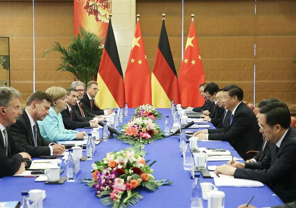 BEIJING, June 13, 2016 (Xinhua) -- Chinese President Xi Jinping meets with German Chancellor Angela Merkel in Beijing, capital of China, June 13, 2016. (Xinhua/Liu Weibing)