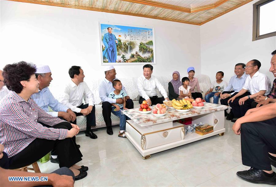 YINCHUAN, July 20, 2016 (Xinhua) -- Chinese President Xi Jinping visits villager of Hui ethnic group Hai Guobao