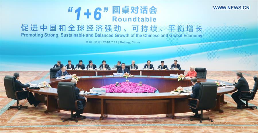 Chinese Premier Li Keqiang holds a round-table meeting with World Bank Group President Jim Yong Kim, IMF (International Monetary Fund) Managing Director Christine Lagarde, WTO (World Trade Organization) Director-General Roberto Azevedo, ILO (International Labor Organization) Director-General Guy Ryder, OECD (Organization for Economic Cooperation and Development) Secretary-General Angel Gurria and FSB (Financial Stability Board) Chairman Mark Carney, at Diaoyutai State Guesthouse in Beijing, capital of China, July 22, 2016.