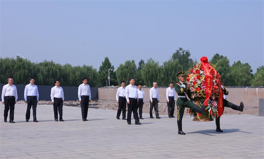 Chinese President Xi Jinping, who is also general secretary of the Communist Party of China (CPC) Central Committee and chairman of the Central Military Commission (CMC), visits a memorial to leave flowers and pay his respect to all those who died in the devastating earthquake and heroes sacrificed in the earthquake relief work at Tangshan Earthquake Memorial Park in Tangshan, north China