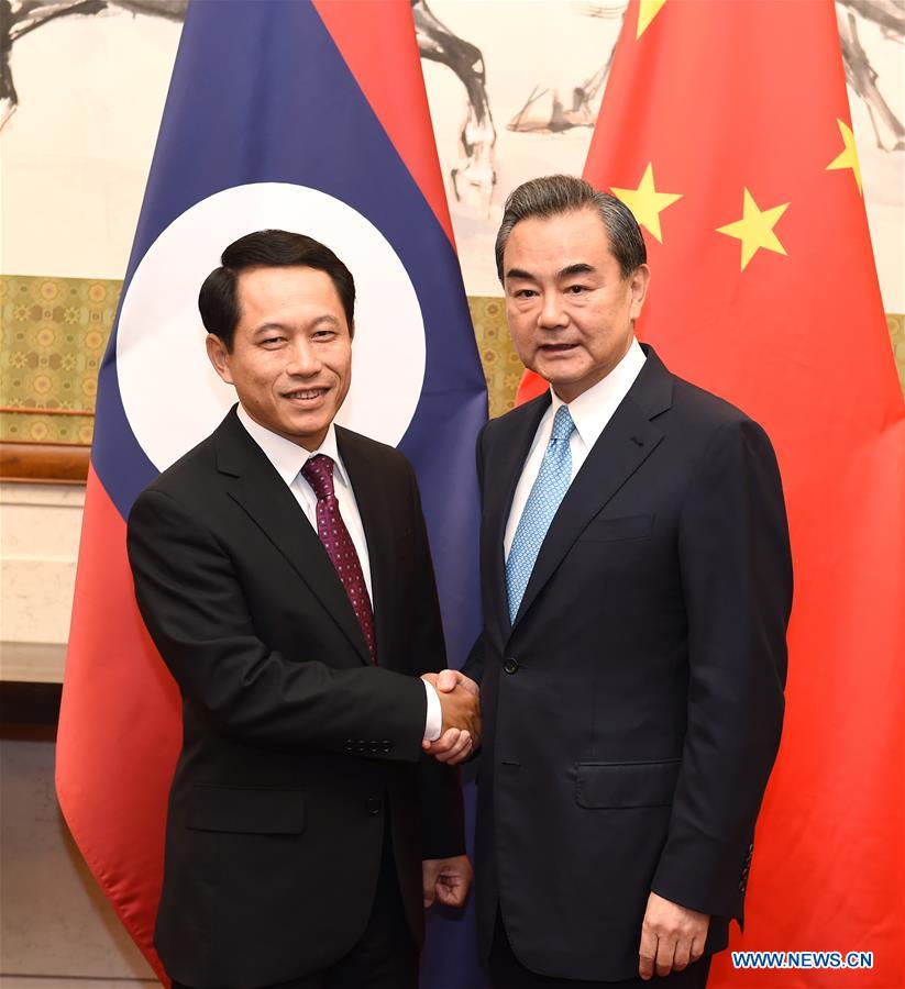 Chinese Foreign Minister Wang Yi (R) holds talks with his Lao counterpart Saleumxay Kommasith in Beijing, capital of China, Aug. 3, 2016. (Xinhua/Zhang Ling)