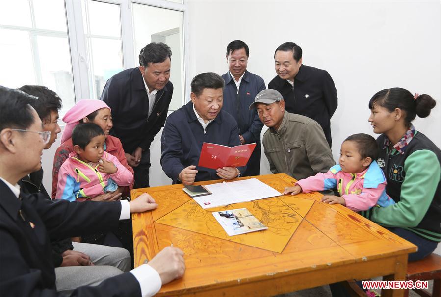 Chinese President Xi Jinping learns about implementation of poverty alleviation measures at the home of villager Lyu Youjin in Wushi Township of Huzhu Tu Autonomous County in Haidong, northwest China