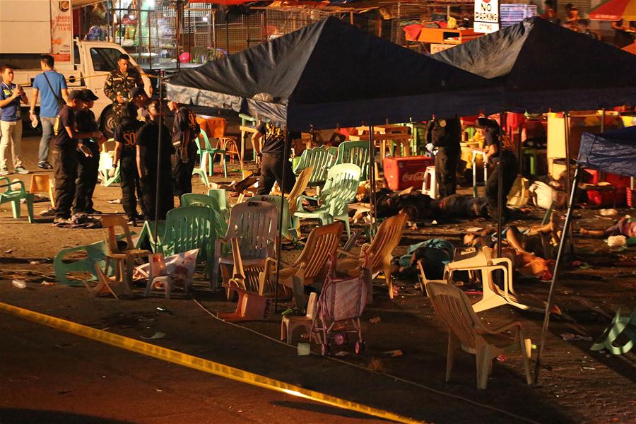 The staff from the Philippine National Police (PNP-SOCO) investigate after an explosion at a market in Davao Province, the Philippines, Sept. 3, 2016. At least 10 people have been confirmed dead and scores others wounded in an explosion in the hometown of Philippine President Rodrigo Duterte on Friday night, officials said on Saturday, amid fears the toll could further rise. (Xinhua/STRINGE)