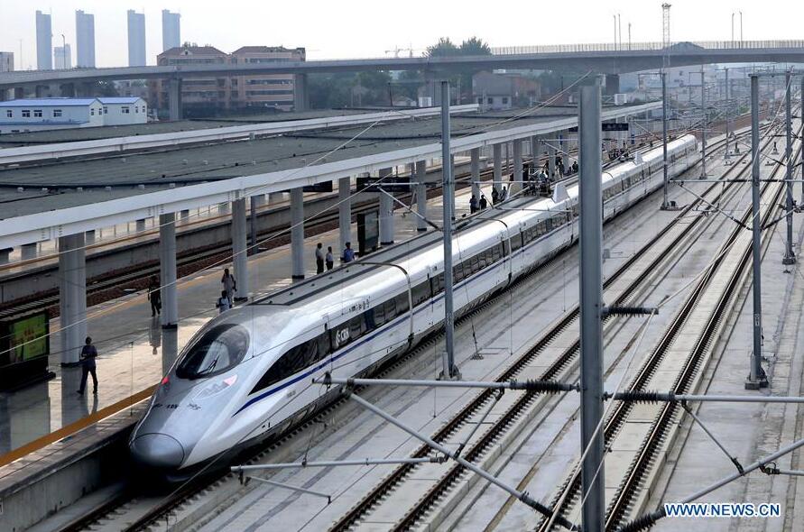 The first train operating on Zhengzhou-Xuzhou high-speed railway stops at Shangqiu Railway Station, central China