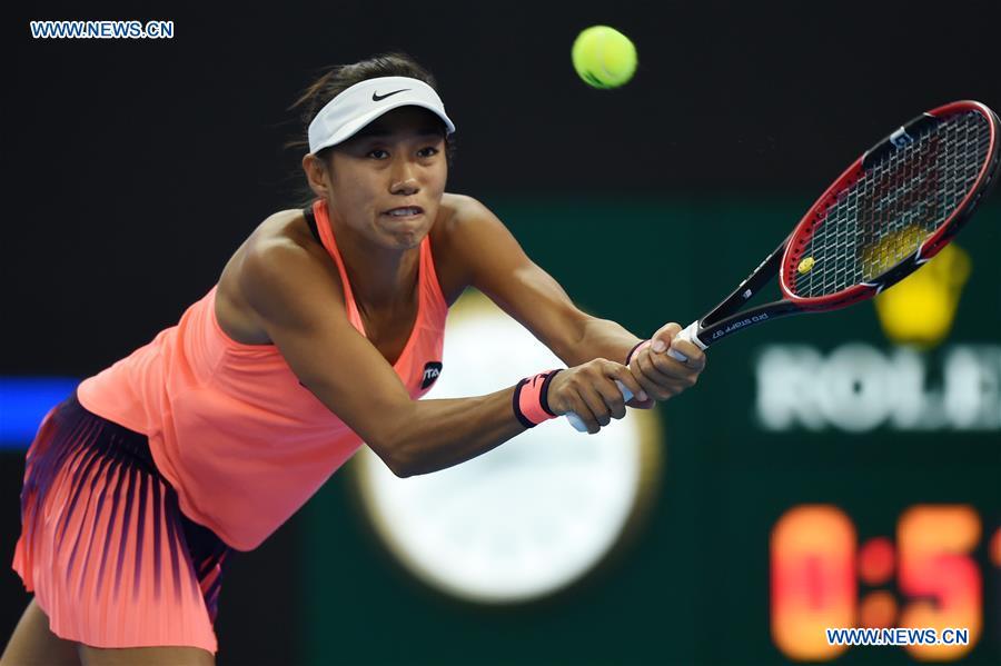 Zhang Shuai of China hits a return to Johanna Konta of Britain during their women
