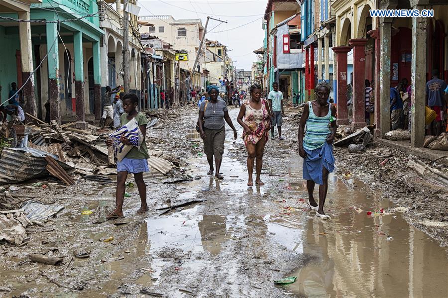 Image provided by the United Nations Stabilization Mission in Haiti shows villagers walking through a flooded street after the pass of Hurricane Matthew, in Jeremie city, Haiti on Oct. 6, 2016. Haiti was hit hardest by Hurricane Matthew in the Caribbean region with more than 271 people reported dead as of Thursday evening. (Xinhua/Logan Abassi/UN/MINUSTAH)