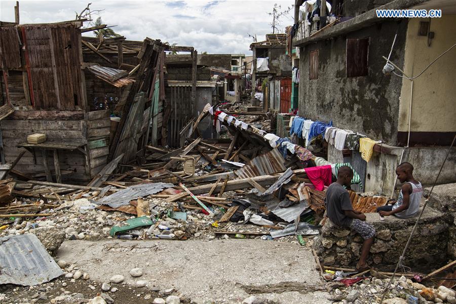 Image provided by the United Nations Stabilization Mission in Haiti shows two boys playing on the debris left by Hurricane Matthew in Jeremie city, Haiti on Oct. 6, 2016. Haiti was hit hardest by Hurricane Matthew in the Caribbean region with more than 271 people reported dead as of Thursday evening. (Xinhua/Logan Abassi/UN/MINUSTAH)