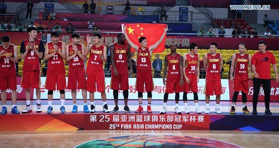 Players of China Xinjiang Kashgar react on the podium during the awarding ceremony at the 25th FIBA Asia Champions Cup in Chenzhou, central China