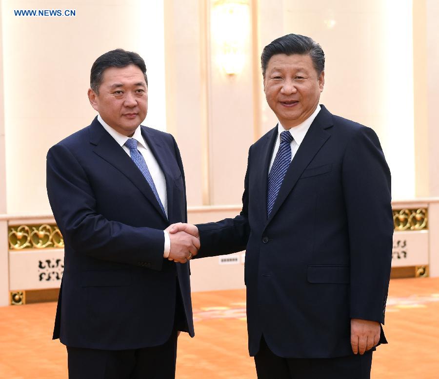 Chinese President Xi Jinping (R) meets with Miyegombo Enkhbold, chairman of the Mongolian People