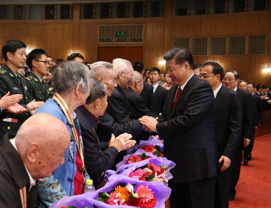 Chinese President Xi Jinping (front, R) shake hands with old veterans of the Red Army before watching a gala commemorating the 80th anniversary of the victory of the Long March in Beijing, capital of China, Oct. 19, 2016. Xi Jinping and other senior leaders Li Keqiang, Zhang Dejiang, Yu Zhengsheng, Liu Yunshan, Wang Qishan and Zhang Gaoli watched the gala in Beijing on Wednesday. (Xinhua/Ma Zhancheng)