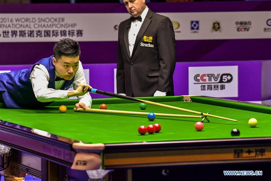 Ding Junhui of China plays a shot during the quarterfinal match against John Higgins of Scotland at the 2016 World Snooker International Championship in Daqing, northeast China