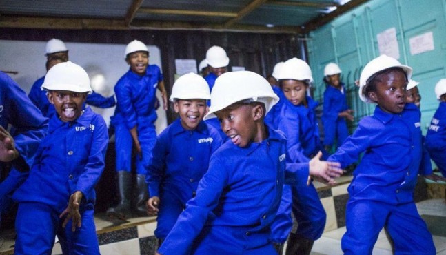  In an effort to help children deal with the violence around them, kids meet after school in this small garage where they learn traditional gumboot dancing.