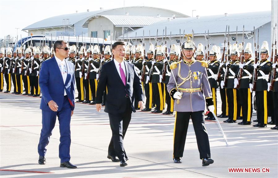 Chinese President Xi Jinping (C) attends a welcoming ceremony held by Ecuadorian President Rafael Correa (L) at the airport in Quito, Ecuador, Nov. 17, 2016. Xi arrived here Thursday for a state visit to Ecuador. (Xinhua/Ju Peng)