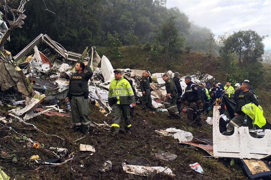 Image provided by Noticias Telemedellin shows rescuers inspecting the site of the crashed plane carrying the Brazilian soccer team Chapecoense, in La Ceja municipality, near Medellin, in the department of Antioquia, Colombia, on Nov. 29, 2016. A plane carrying players from Brazilian football team Chapecoense has crashed in Colombia, killing 76 people, authorities said on Tuesday. (Xinhua/Noticias Telemedellin)