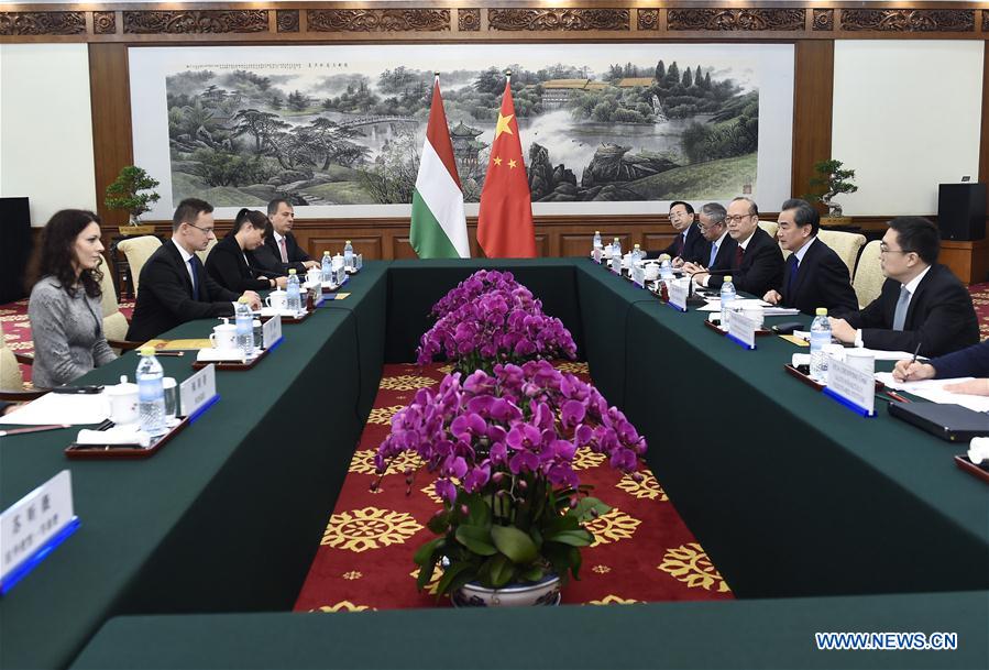 Chinese Foreign Minister Wang Yi (2nd R) holds talks with visiting Hungarian Foreign Affairs and Trade Minister Peter Szijjarto (2nd L) in Beijing, capital of China, Nov. 30, 2016.