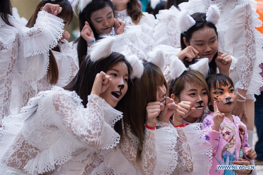 Actors take part in the "Parade through Macao, Latin City" in Macao, south China, Dec. 4, 2016. The parade was held here on Sunday to mark the 17th anniversary of Macao