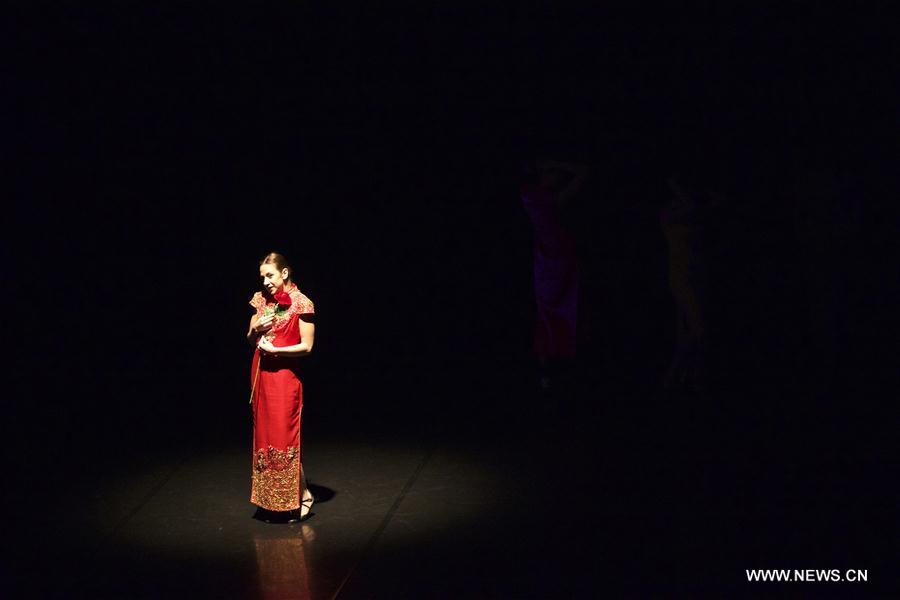 A performer dances during the dancing show "Heaven, Earth, People" in Rome, Italy, Dec. 10, 2016. The show "Heaven, Earth, People" is directed by Two Chinese students Zheng Lu and Jiang Churui, who graduated from Beijing Dancing Academy. (Xinhua/Jin Yu) 