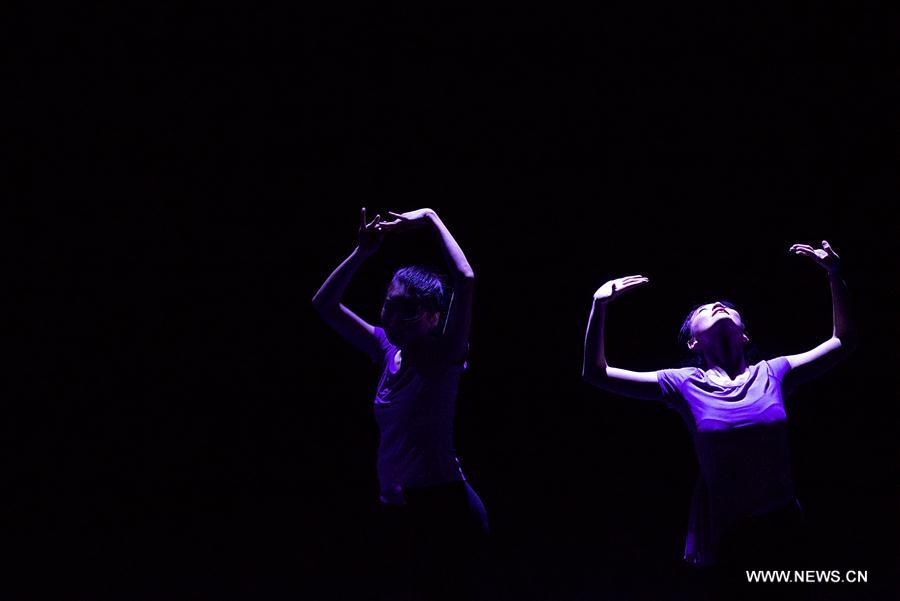 Performers dance during the dancing show "Heaven, Earth, People" in Rome, Italy, Dec. 10, 2016. The show "Heaven, Earth, People" is directed by Two Chinese students Zheng Lu and Jiang Churui, who graduated from Beijing Dancing Academy. (Xinhua/Jin Yu)