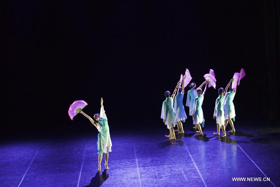 Performers dance during the dancing show "Heaven, Earth, People" in Rome, Italy, Dec. 10, 2016. The show "Heaven, Earth, People" is directed by Two Chinese students Zheng Lu and Jiang Churui, who graduated from Beijing Dancing Academy. (Xinhua/Jin Yu) 
