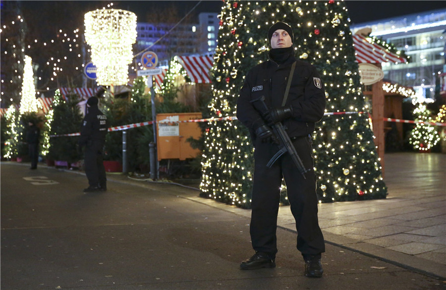 German police officers secure the site of an accident with a truck at a Christmas market on Breitscheidplatz square near the fashionable Kurfuerstendamm avenue in the west of Berlin, Germany, Dec 19, 2016. 