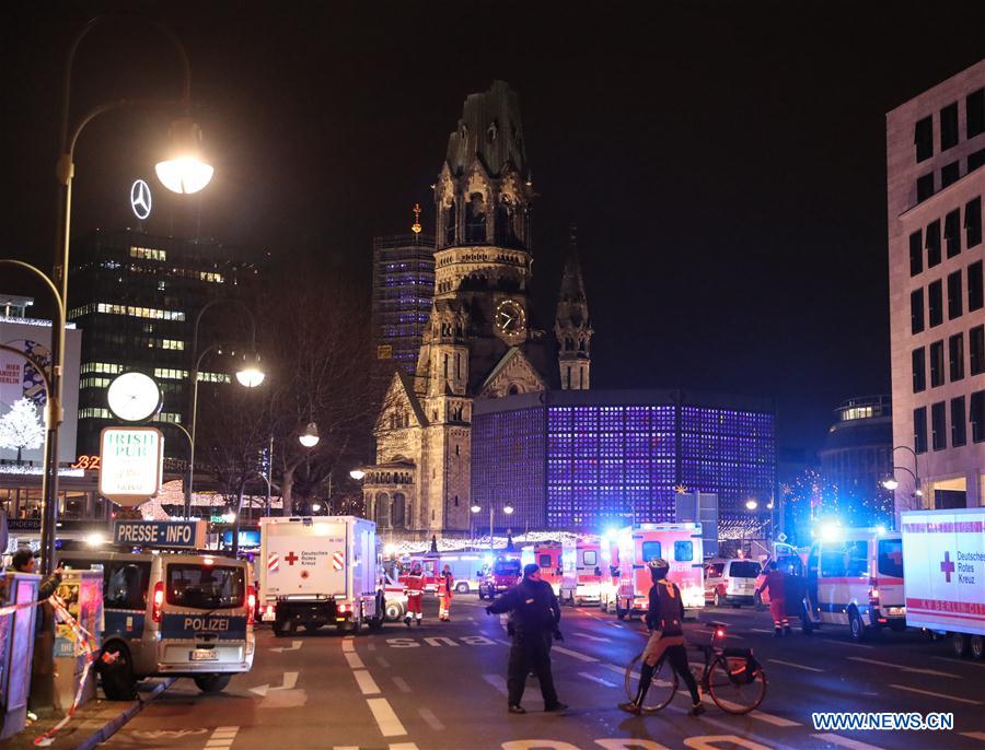Police cordon off streets near the site of a lorry crash at a Christmas market in Berlin, Germany, Dec. 19, 2016. A lorry ploughed into a crowd at a Christmas market in Berlin on Monday night, killing nine people and injuring many others, Berlin police announced over Twitter. (Xinhua/Shan Yuqi)