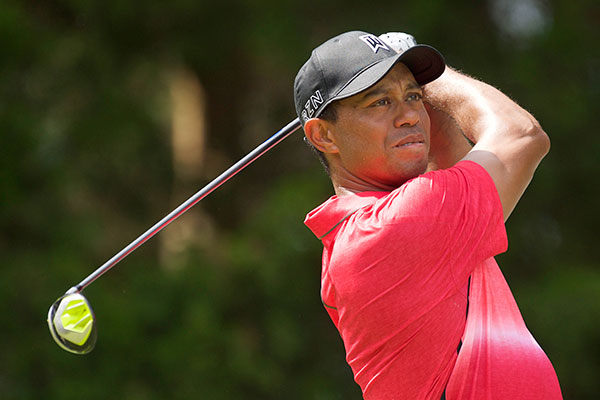 Tiger Woods watches his shot after teeing off on the 2nd hole in the final round of the Quicken Loans National golf tournament at Robert Trent Jones Golf Club in Gainesville, Virginia, in this file photo taken August 2, 2016.[Photo/Agencies]