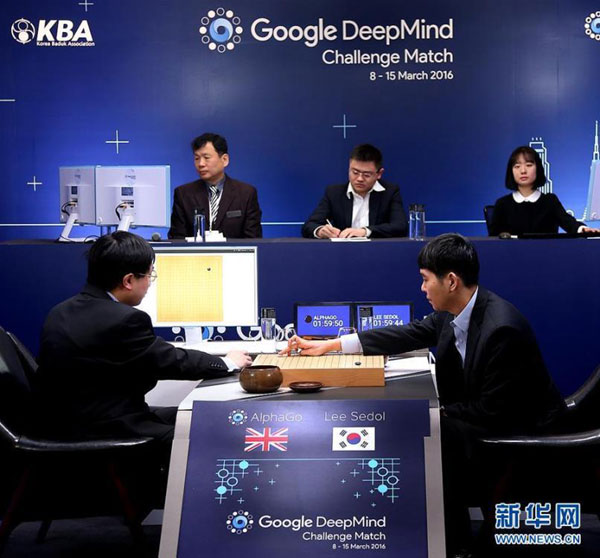 South Korean professional Go player Lee Sedol, right, puts a stone against Google