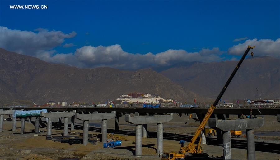 Photo taken on Jan. 6, 2017 shows the bridge construction site of the south section of a ring road near the Potala Palace in Lhasa, capital of southwest China