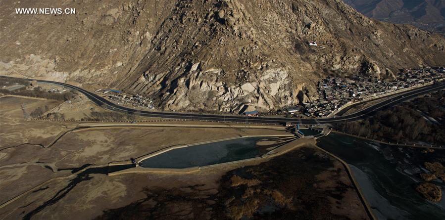 Photo taken on Jan. 6, 2017 shows the bridge construction site of the south section of a ring road near the Potala Palace in Lhasa, capital of southwest China