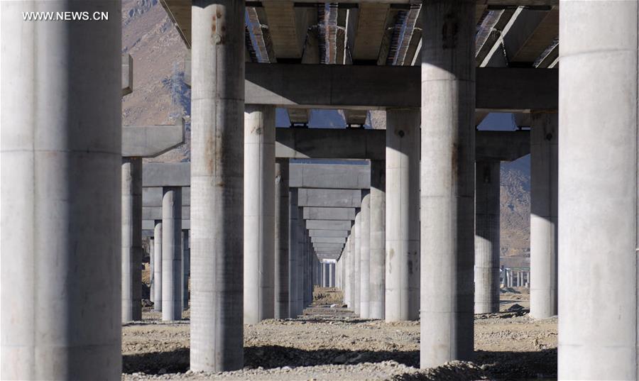 Photo taken on Jan. 6, 2017 shows the bridge construction site of the south section of a ring road near the Potala Palace in Lhasa, capital of southwest China