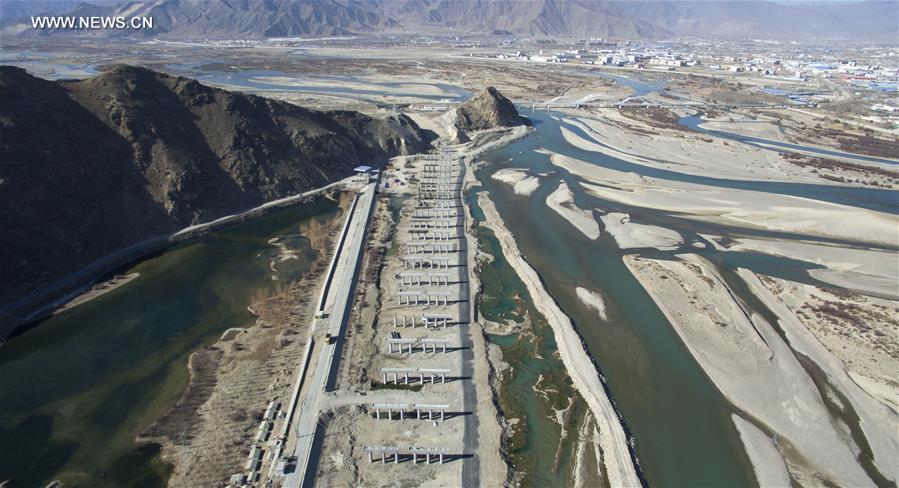 Photo taken on Jan. 6, 2017 shows the bridge construction site of the south section of a ring road near the Potala Palace in Lhasa, capital of southwest China