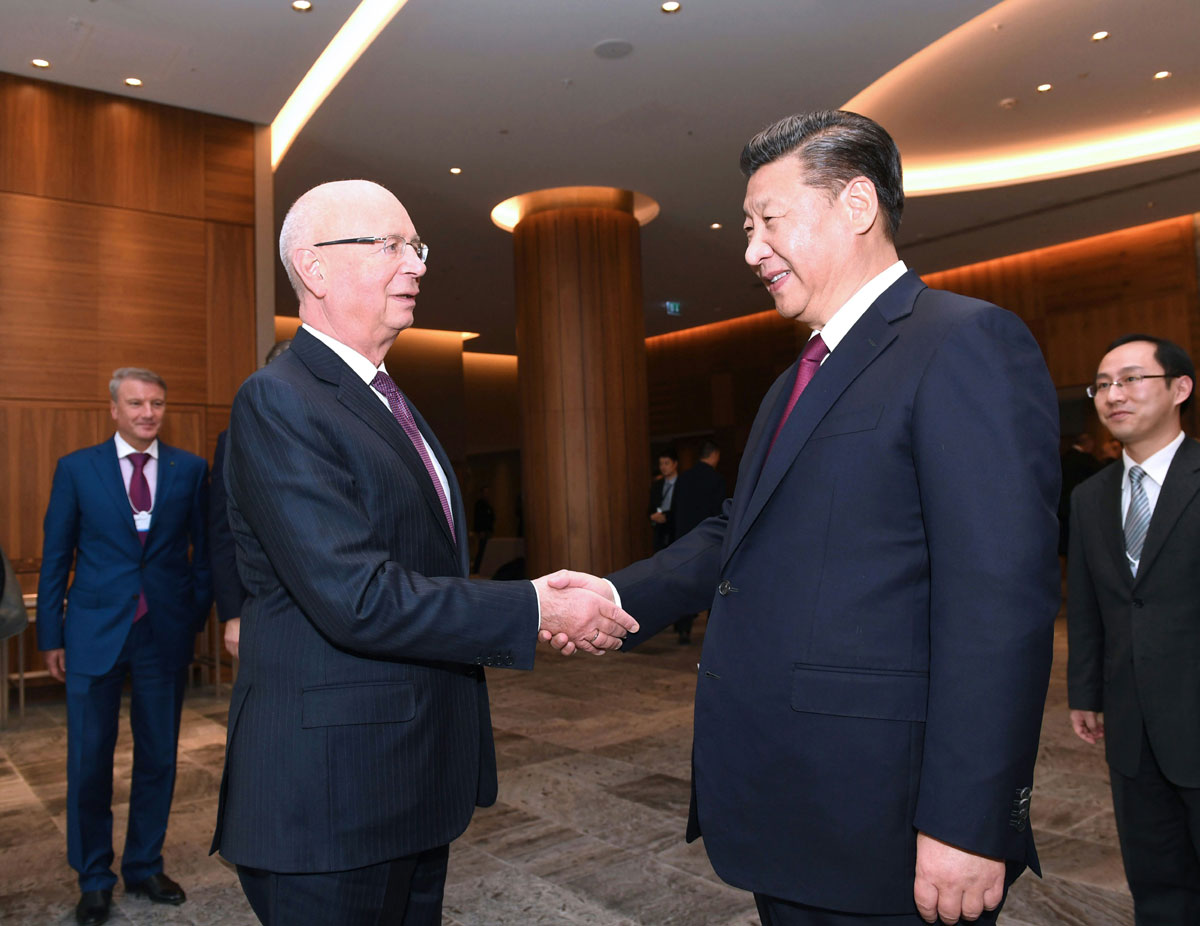 Chinese President Xi Jinping (R) meets with Klaus Schwab (L), World Economic Forum founder and Executive Chairman, in Davos, Switzerland, January 17, 2017. [Photo: Xinhua/Rao Aimin]