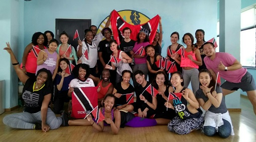 With Trinidad and Tobago&rsquo;s flag in hand, participants of Soca Zumba strike a pose. The event was held on February 25 at Caravan in Jianguomen.