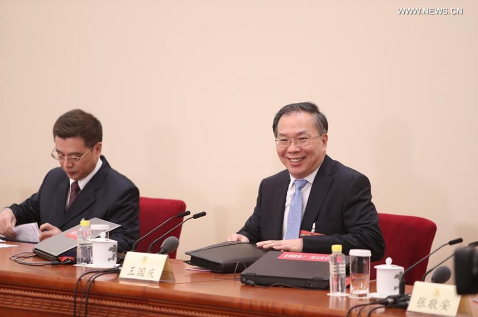 Wang Guoqing (R), spokesperson for the fifth session of the 12th Chinese People
