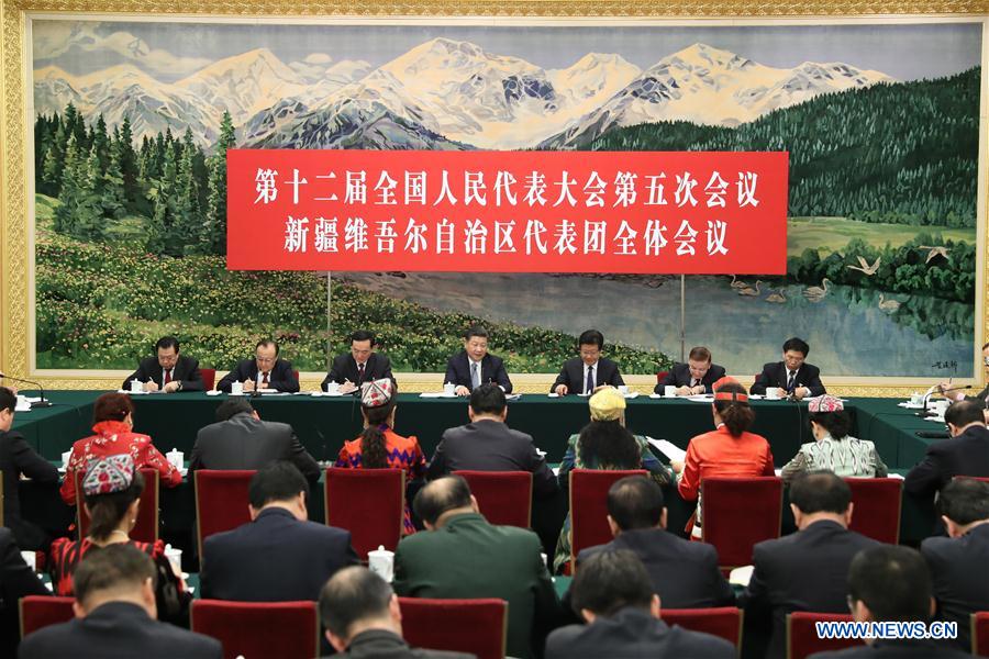  Chinese President Xi Jinping joins a panel discussion with deputies to the 12th National People