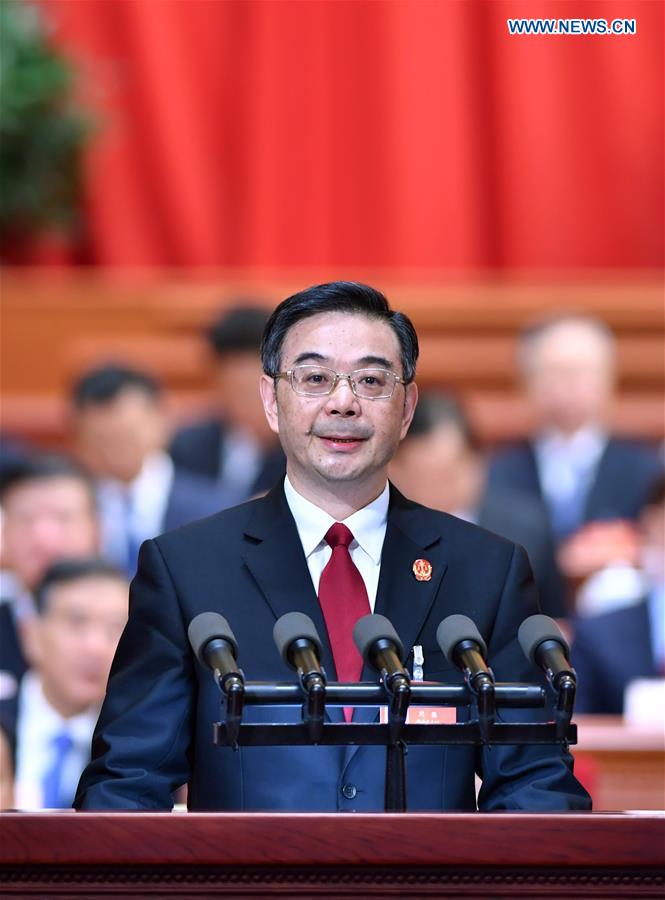 Chief Justice Zhou Qiang delivers a work report of the Supreme People
