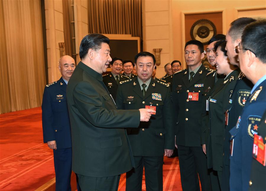 Chinese President Xi Jinping, also general secretary of the Communist Party of China Central Committee and chairman of the Central Military Commission, meets with deputies from grassroots units to the 12th National People