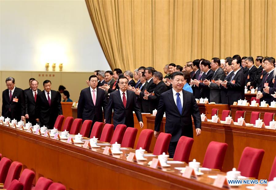 Xi Jinping, Li Keqiang, Zhang Dejiang, Yu Zhengsheng, Liu Yunshan, Wang Qishan and Zhang Gaoli walk onto the rostrum during the closing meeting of the fifth session of the 12th National Committee of the Chinese People