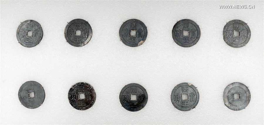 Photo taken on March 17, 2017 shows silver coins unearthed during an archaeological excavation at Pengshan District in Meishan City, southwest China