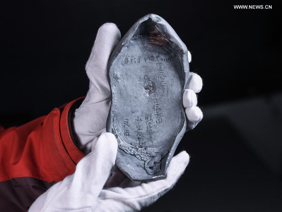 Photo taken on March 19, 2017 shows a silver ingot unearthed during an archaeological excavation in Pengshan District under Meishan City, southwest China