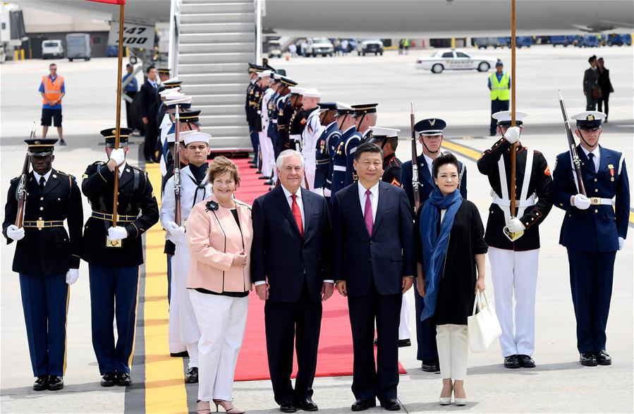 Chinese President Xi Jinping (2nd R, front) and his wife Peng Liyuan (1st R, front) are welcomed by U.S. Secretary of State Rex Tillerson (2nd L, front) and his wife upon their arrival at Palm Beach International Airport in Florida, the United States, April 6, 2017. Xi arrived here for the first meeting with U.S. President Donald Trump. (Xinhua/Wu Xiaoling)