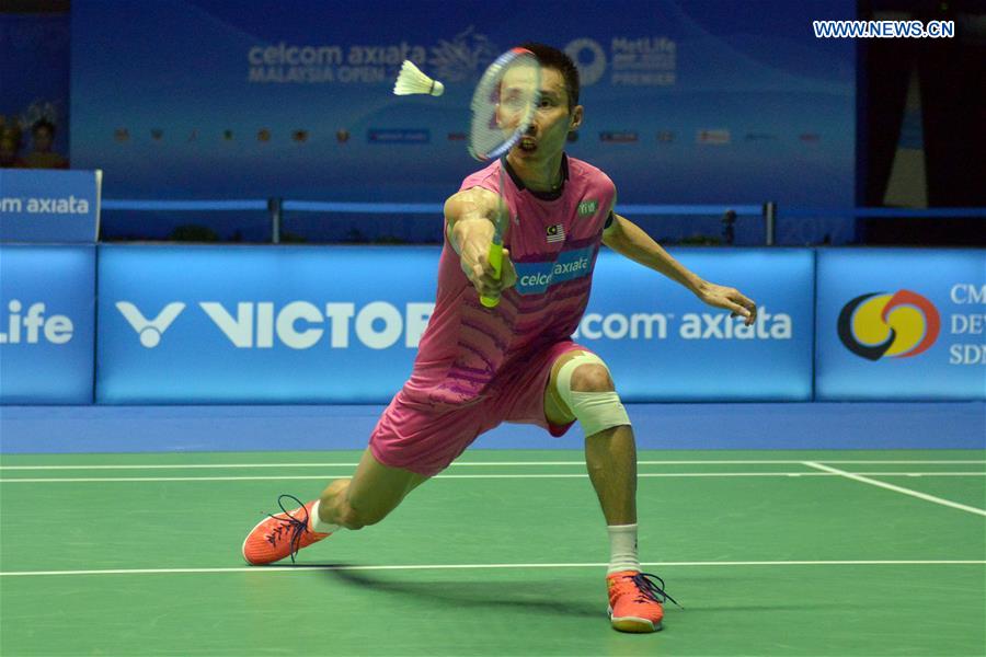 Lee Chong Wei of Malaysia returns the shuttlecock during the men